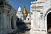 Myanmar - Mandalay, Kuthodaw Pagoda. 729 white pitaka pagodas contain the Tipitaka, the sacred texts of Theravada Buddhism. 